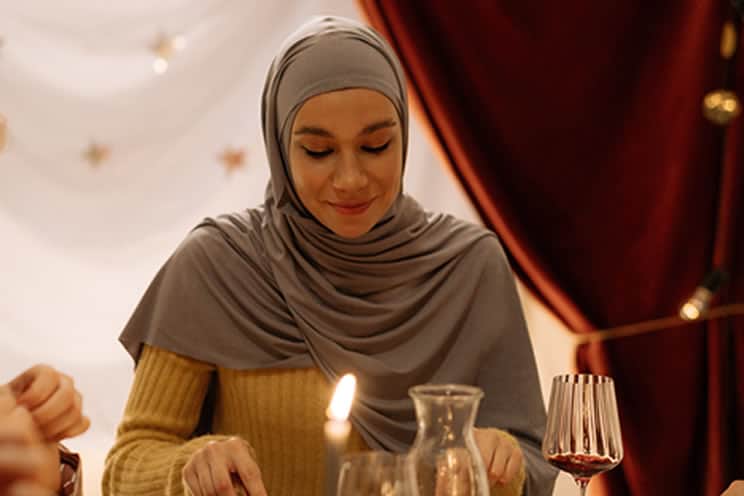 Muslim guest eating at wedding